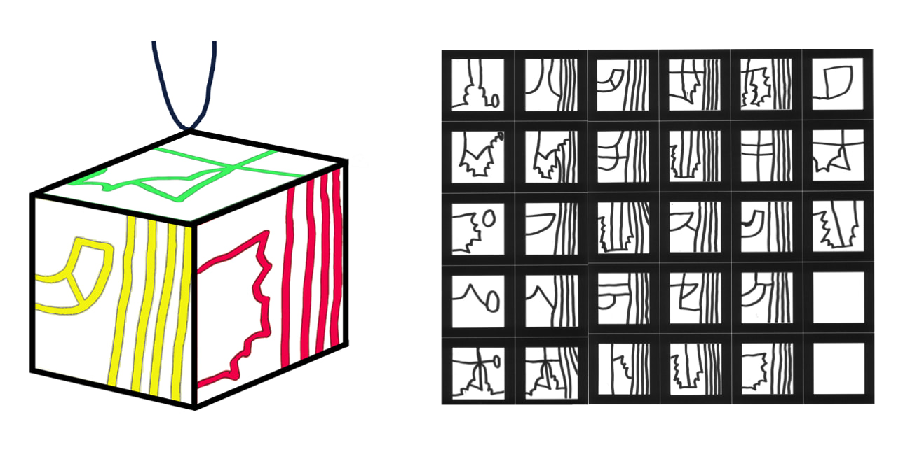 オーナメントのイラスト。小林さんの文字の作品が、立方体の各面に描かれている。